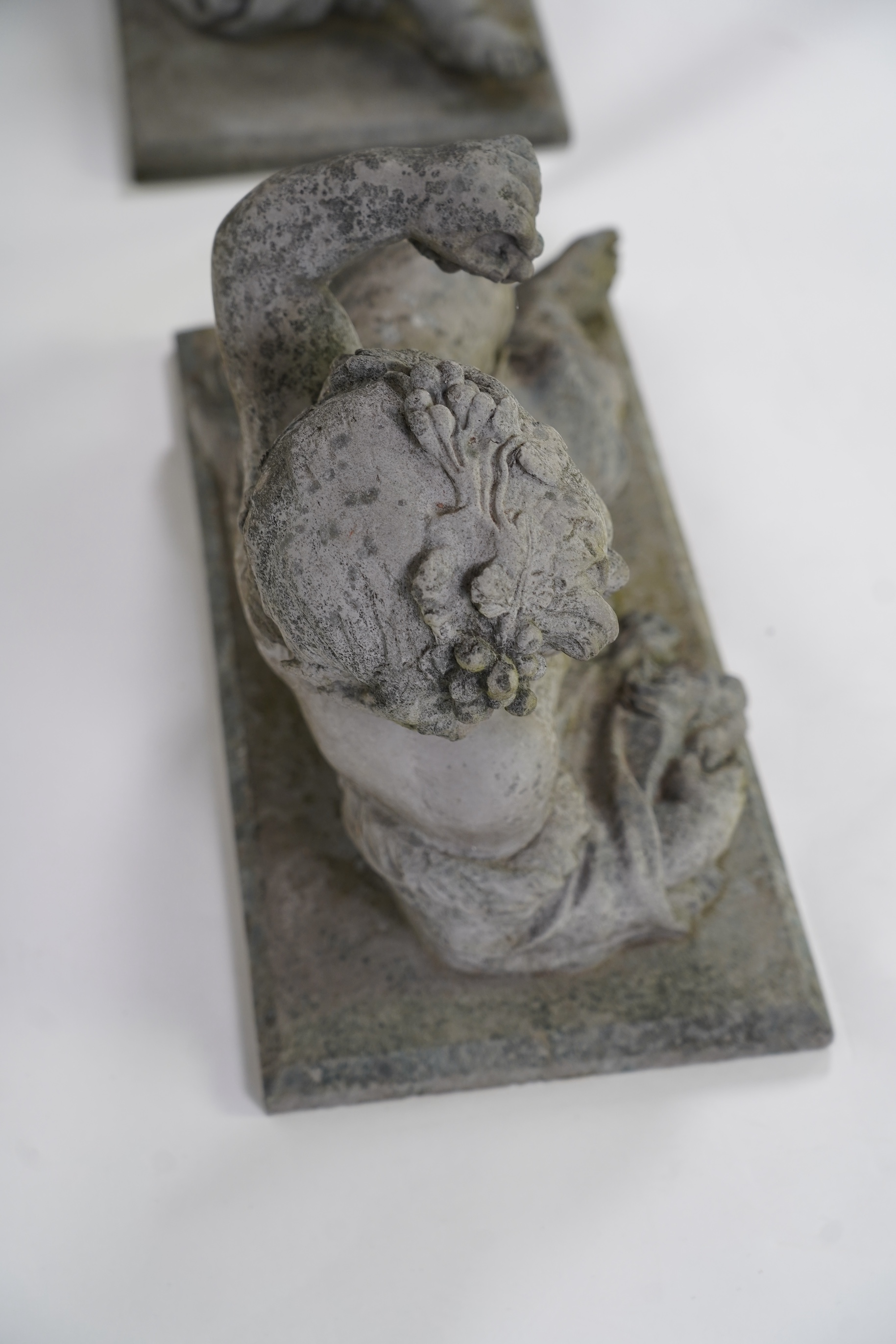 A pair of simulated lead garden sculptures, Emblematic of Summer and Autumn